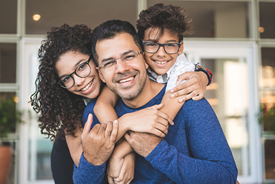Family with glasses smiling